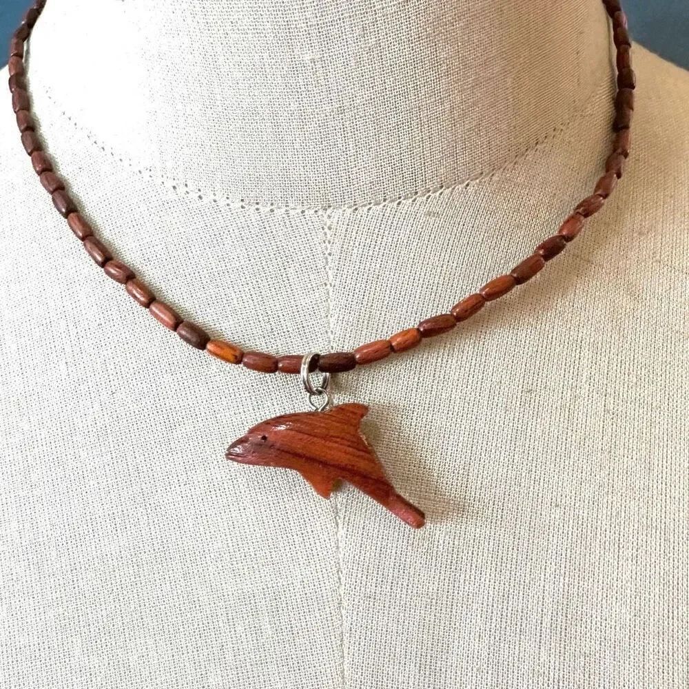 Wood beaded dolphin pendant necklace